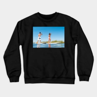 Man and woman stand up paddleboarding Crewneck Sweatshirt